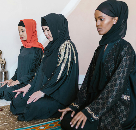 Women in prayer posture (jalsa)