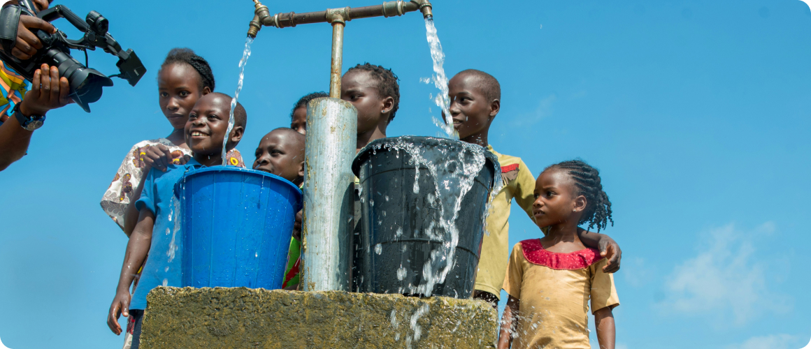 Volunteers around a well