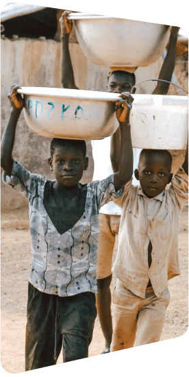 Two children carrying basins